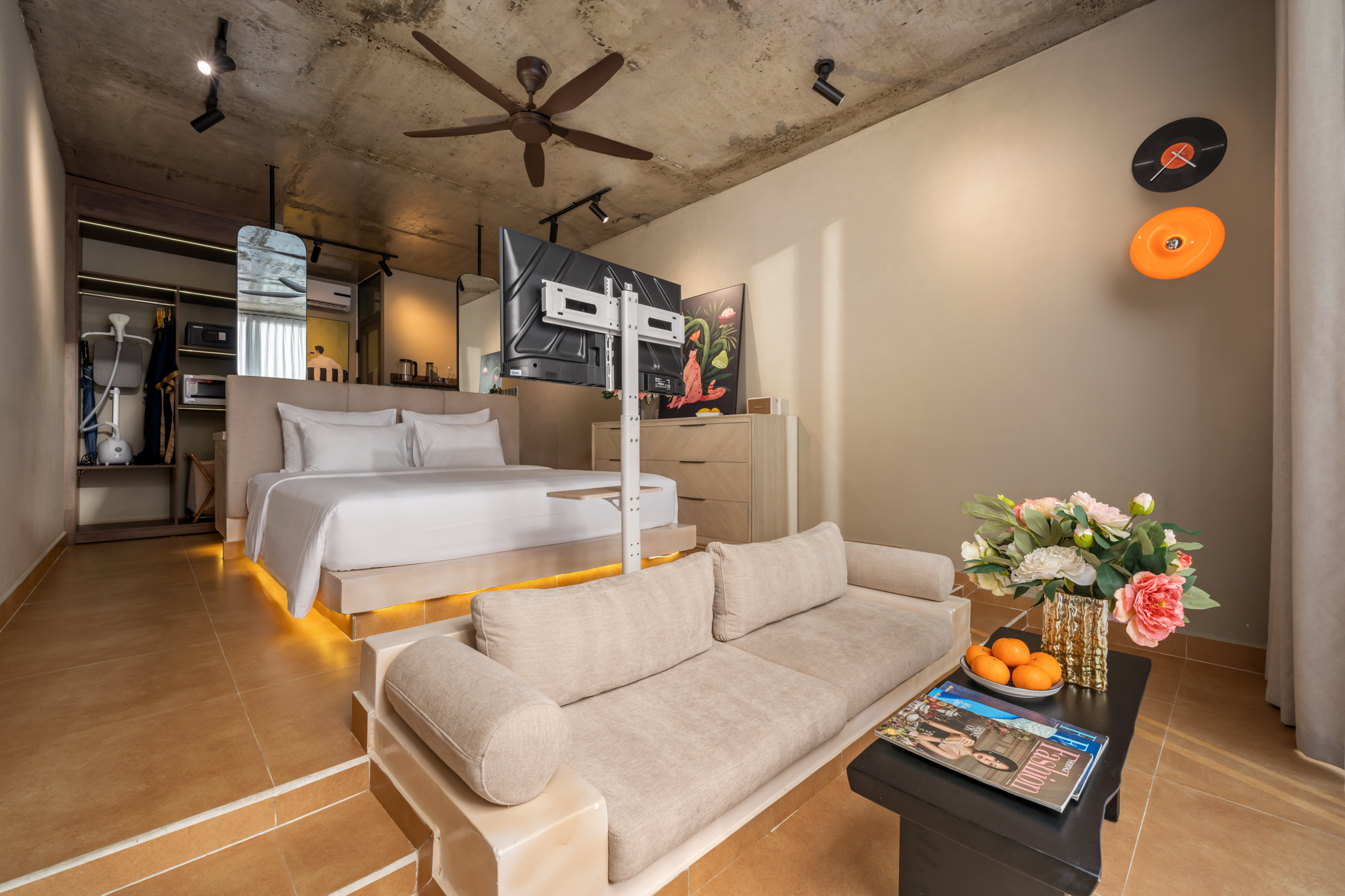 Bedroom and lounge area at Orchids Villas