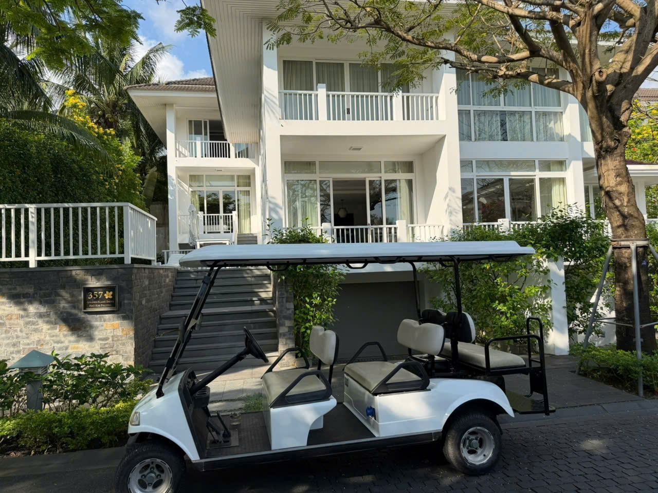 Exterior and electric buggy at Premier Villa